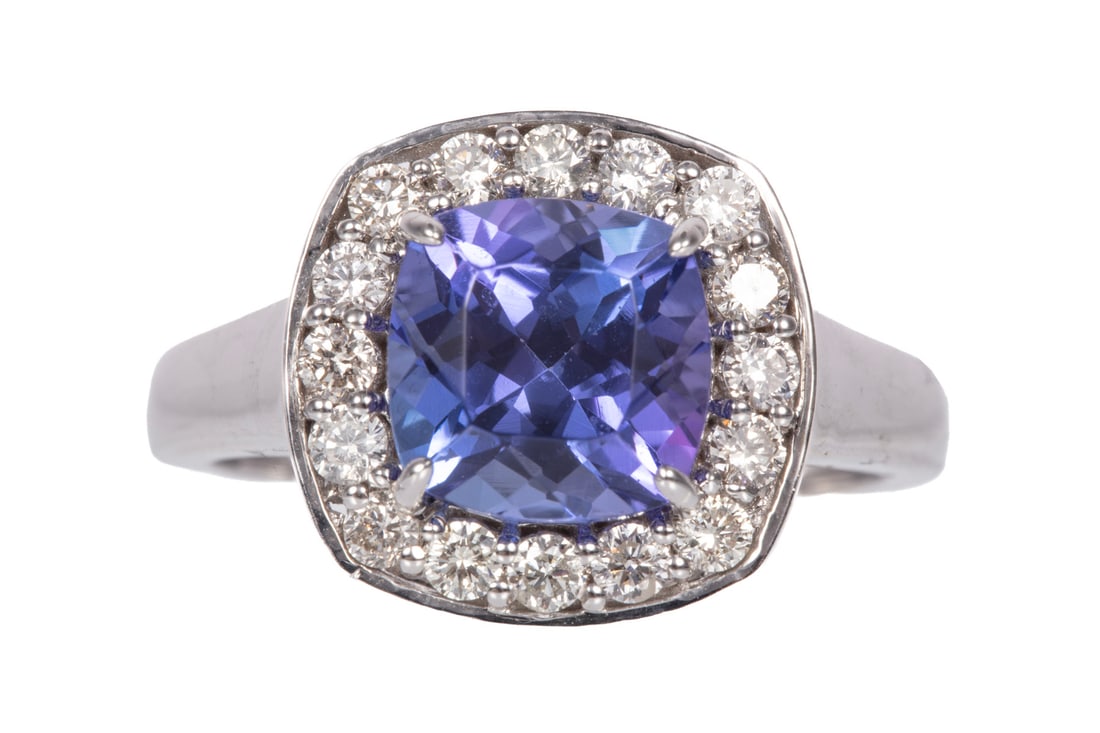 14 kt. White Gold, Tanzanite and Diamond Ring: 14 kt. White Gold, Tanzanite and Diamond Ringcenter cushion mixed cut tanzanite, wt. approx. 2.88 cts.; bezel with 0.48 ct. of round brilliant cut diamonds; size 7; GGA report.Please Note: Payment for