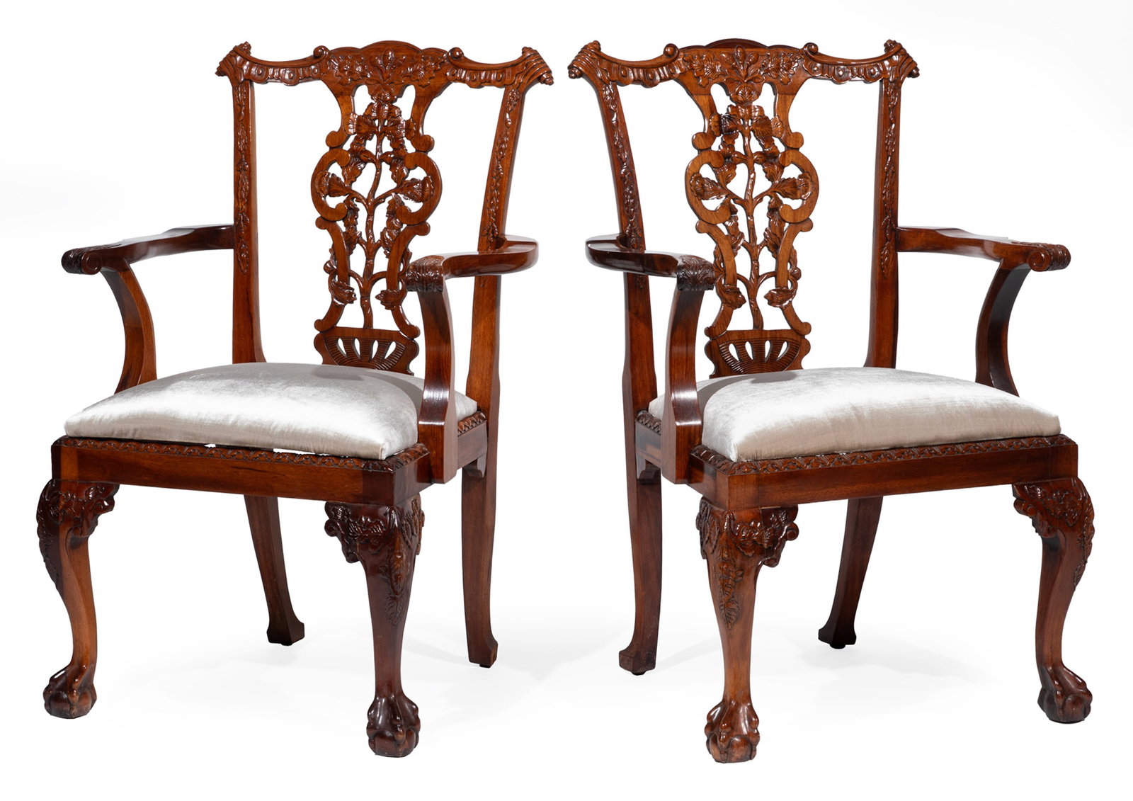 Pair of Chippendale-Style Carved Mahogany Armchairs: Pair of Chippendale-Style Carved Mahogany Armchairs, Labeled Paramount Antiques, New York, after a Thomas Chippendale design, scrolled crest rail, pierced carved foliate splat, scroll arms with acanth