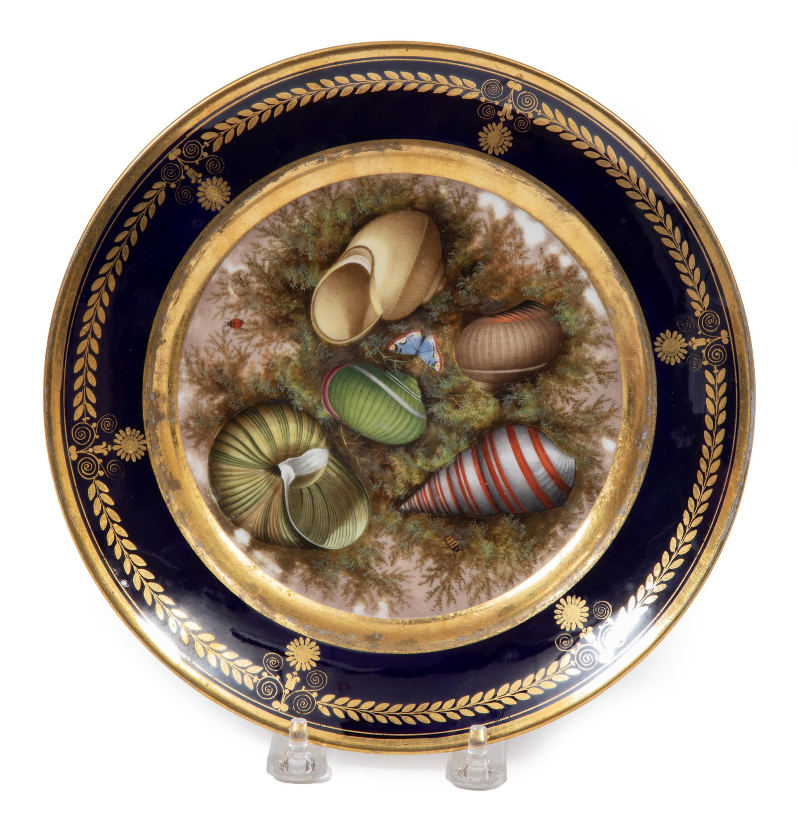 Darte Paris Porcelain Cabinet Plate: Darte Paris Porcelain Cabinet Plate, c. 1820, stencilled mark "DARTE/Pal.Royal/No. 21" in red; finely painted center with shells and insects on moss, gilt foliate border on bleu de roi ground. Diamete