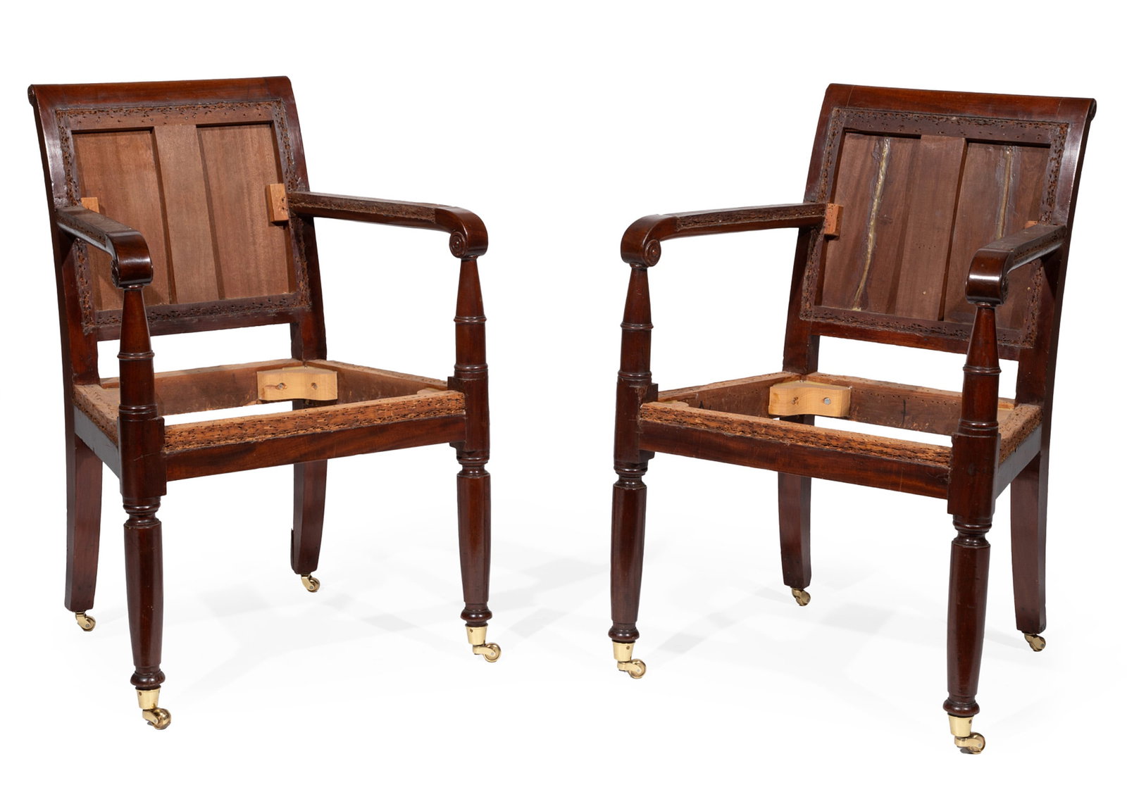 Pair of American Classical Carved Mahogany Armchairs in the Restauration Taste: Pair of American Classical Carved Mahogany Armchairs in the Restauration Taste c. 1830, frames, no upholstery, turned arms supports, connected to conforming round legs, now with later brass casters 35