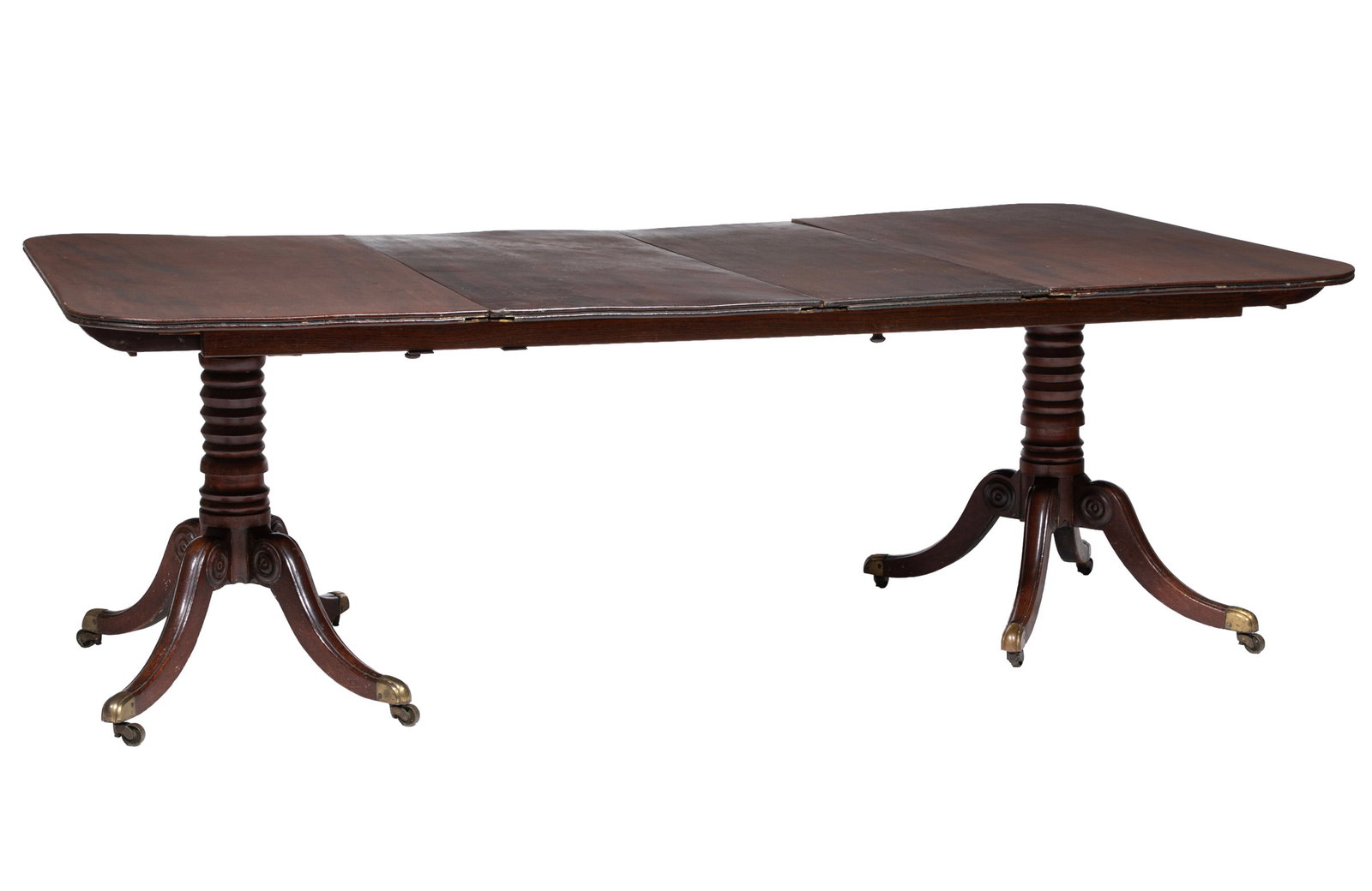 American Late Federal Carved Mahogany Dining Table: American Late Federal Carved Mahogany Dining Table 19th c., reeded edge, ring turned standard, reeded sabre legs brass casters, two leaves 27 1/2 x 45 x 47 in. (69.9 x 114.3 x 119.4 cm.), open 27 1/2 