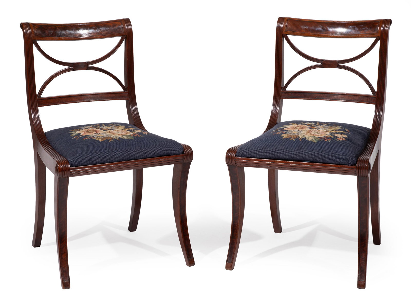 Rare Pair of American Federal Carved Mahogany Klismos Chairs: Rare Pair of American Federal Carved Mahogany Klismos Chairs c. 1810-30s., attirbuted to Duncan Phyfe, New York, paneled crest, crossed back, reeded stiles, slip seat, sabre legs Note: The configurati