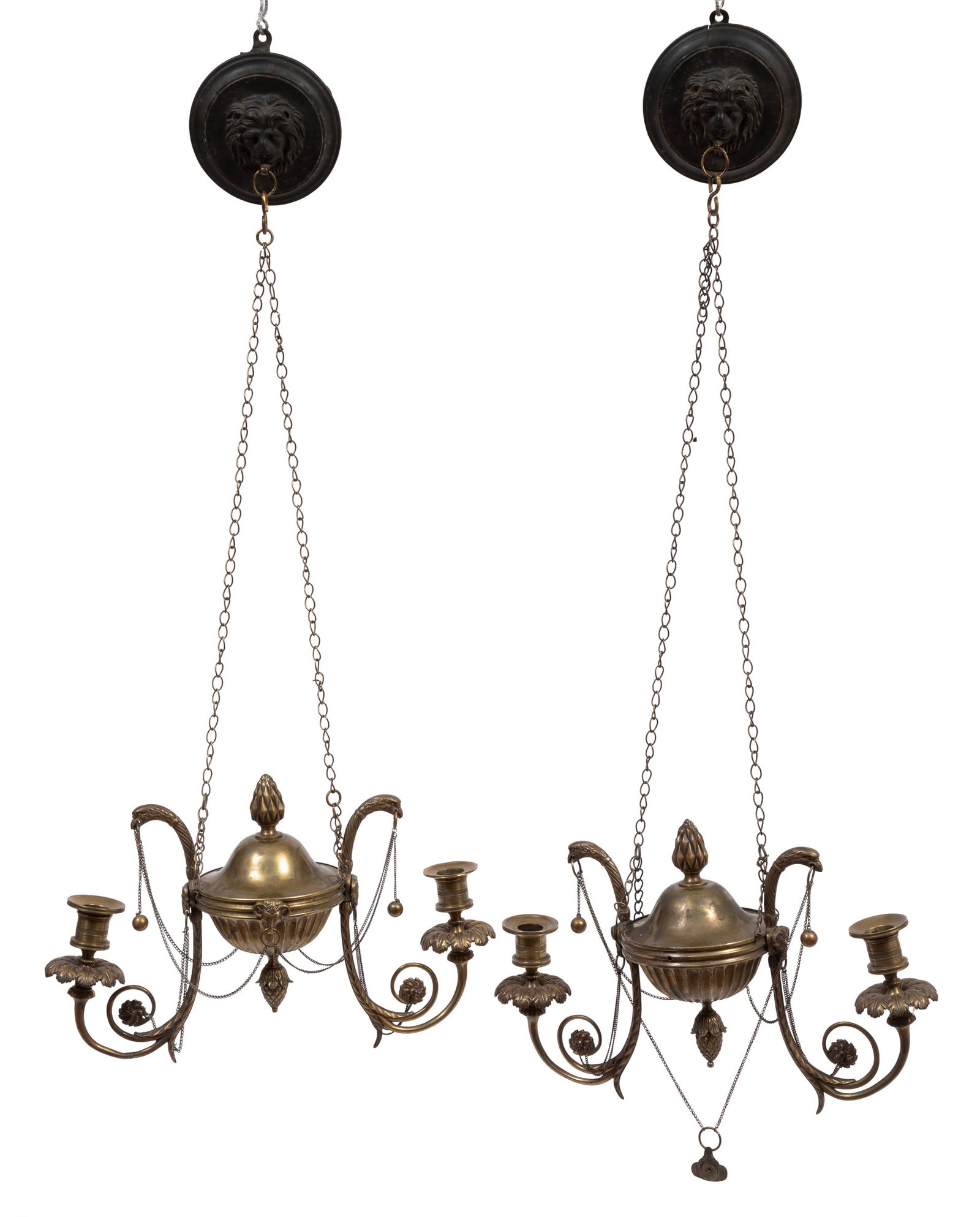 Pair of Regency Brass Two-Light Hanging Candle Lamps: Pair of Regency Brass Two-Light Hanging Candle Lamps c. 1810, carved lion mask wall plates, fluted urn bodies, scroll branches with eagle finials, h. with chain 31 in., w. 14 in., d. 5 in. Provenance: