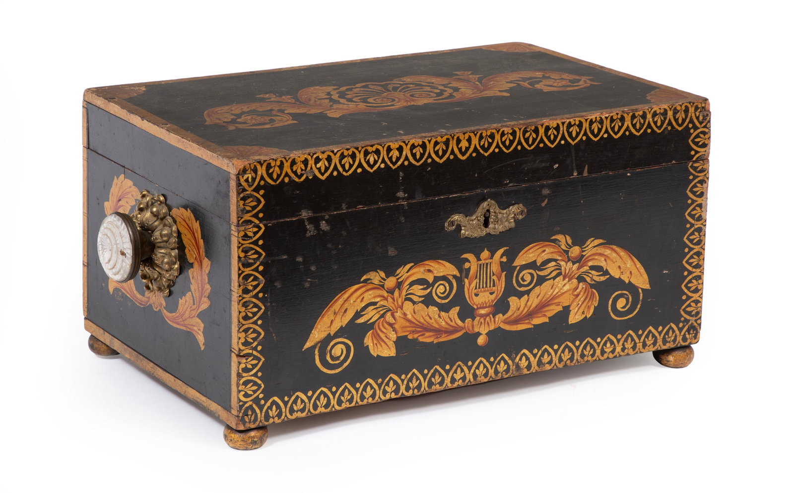American Classical Ebonized and Stenciled Box: American Classical Ebonized and Stenciled Box early 19th c., Baltimore, decorated with shells and foliate scrolls, lyres and foliate swags, anthemion border, with a pair of foliate pressed brass and c