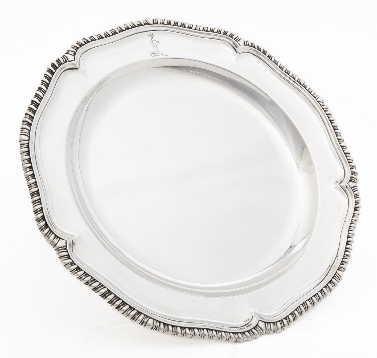 George III Sterling Silver Charger: George III Sterling Silver Charger, London, marks rubbed, serpentine gadrooned rim, molded cavetto with engraved armorial, diameter 12 in., weight 31.15 troy ozs.