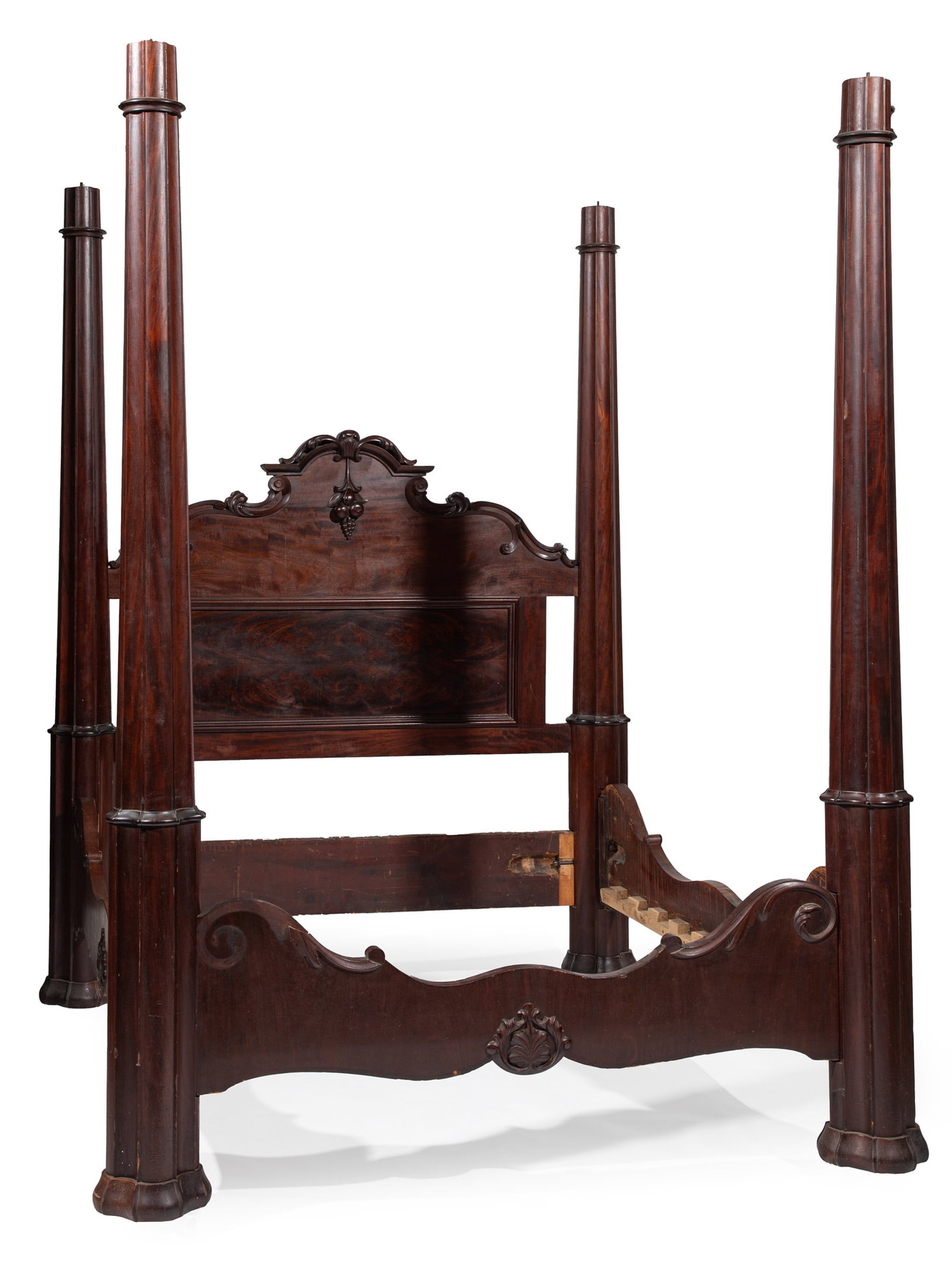 American Rococo Carved Mahogany Four Poster Bed: American Rococo Carved Mahogany Four Poster Bed 19th c., Stamped C. Lee 1204, , reverse tapered lobed posts with quatrefoil collars, carved crest with pendant grapes and pomegranate, paneled headboard
