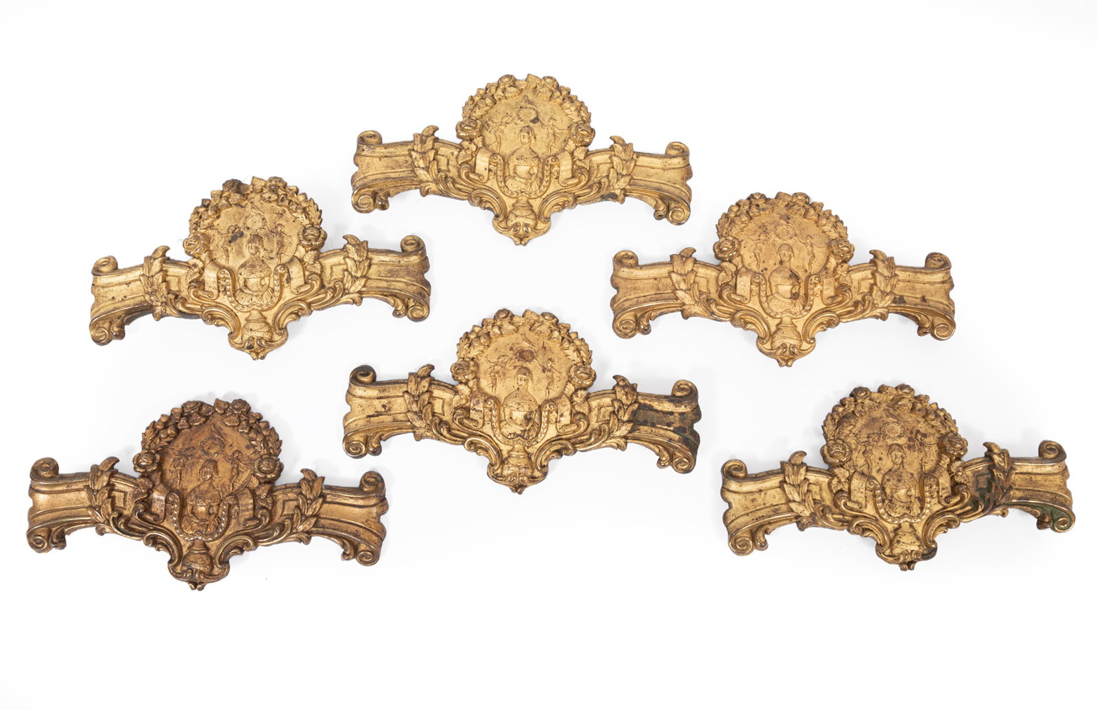 Set of Six English Gilt and Pressed Brass Jenny Lind Theme Curtain Tie Backs: Set of Six English Gilt and Pressed Brass Jenny Lind Theme Curtain Tie Backs , mid-19th c., with registry mark, 4 3/4 x 9 in. (12.1 x 22.9 cm.)