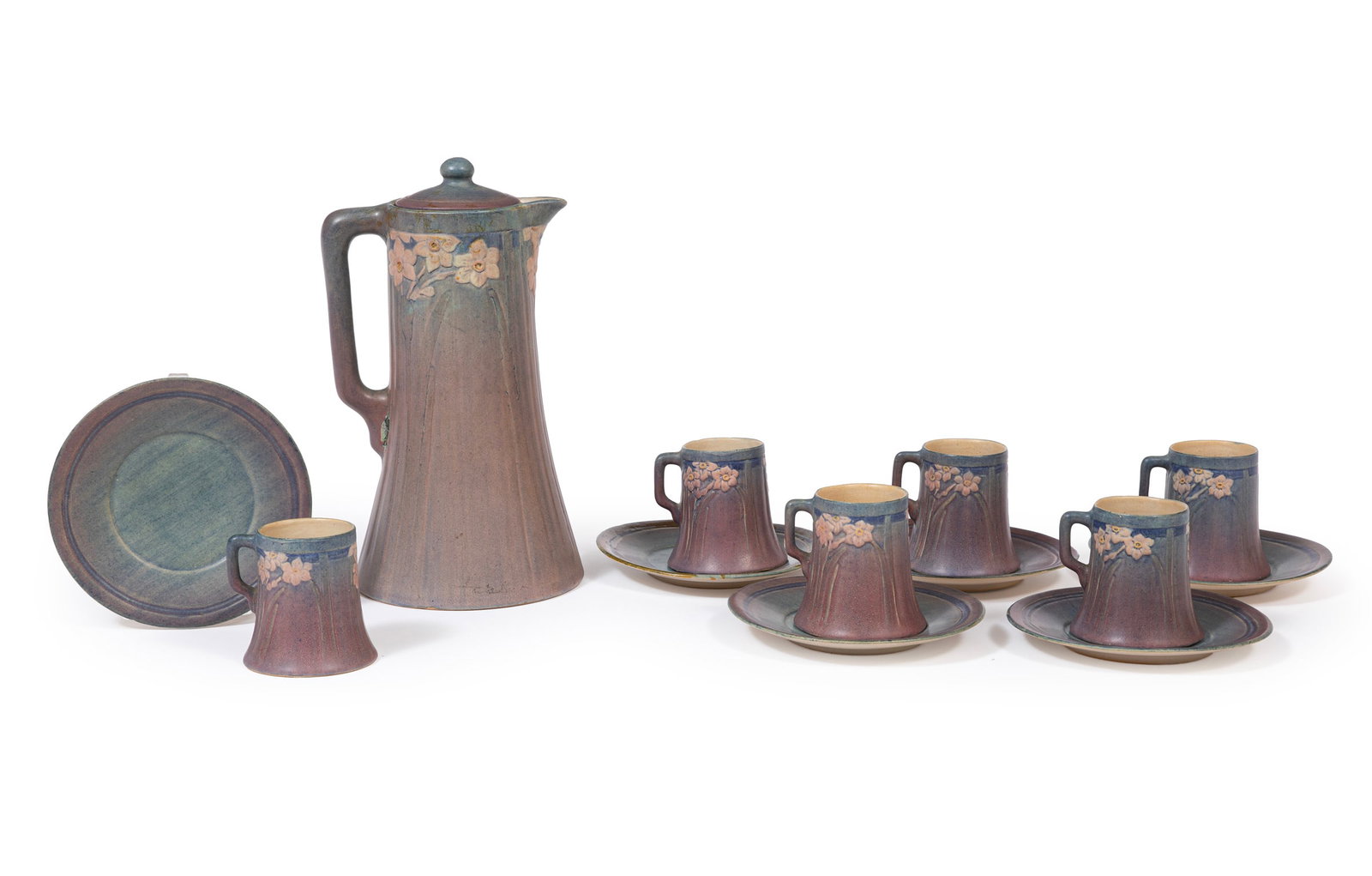 Newcomb College Art Pottery Chocolate Pot with Six Cups and Saucers: Newcomb College Art Pottery Chocolate Pot with Six Cups and Saucers before 1928, matte glaze with blue, green, and pink underglaze, bases with Joseph Meyer's potter's mark, pitcher and cups with relie
