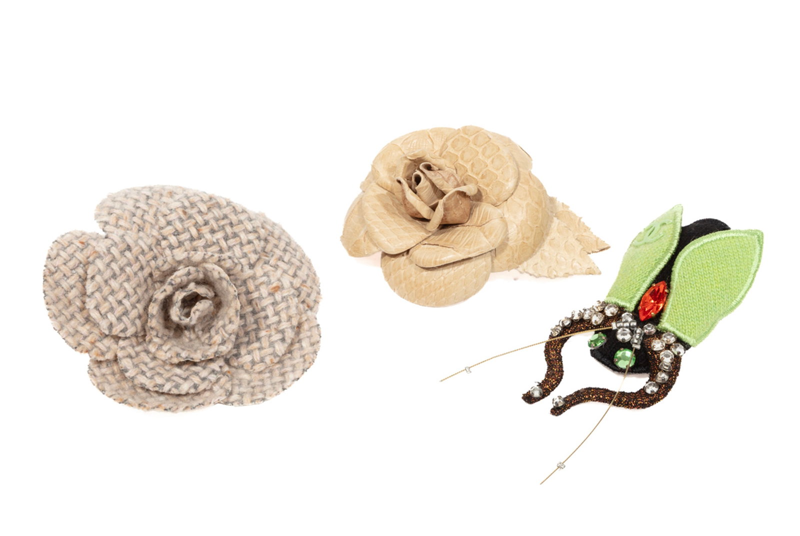 Three Vintage Chanel Brooches: Three Vintage Chanel Brooches incl. bejeweled cashmere beetle brooch, l. 3 1/2 in.; alligator leather camellia brooch, dia. 3 in.; and neutral tweed camellia brooch, dia. 4 in.; together with one orig