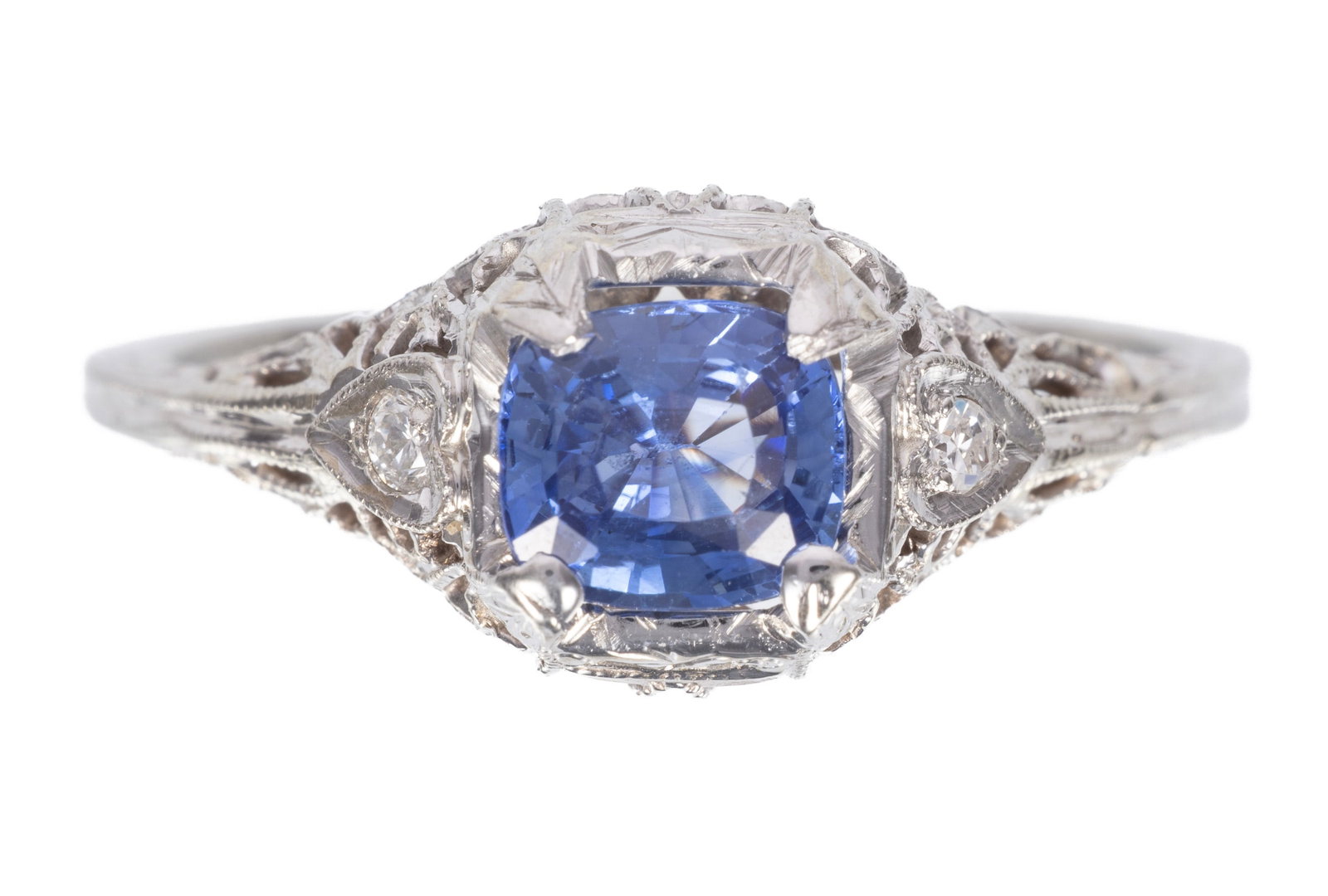 18 kt. White Gold, Sapphire and Diamond Ring: 18 kt. White Gold, Sapphire and Diamond Ring center cushion mixed cut blue sapphire, wt. approx. 1.14 cts.; accented by 2 round diamonds, total wt. approx. 0.06 ct.; size 8.25; AIGL report. Please Not
