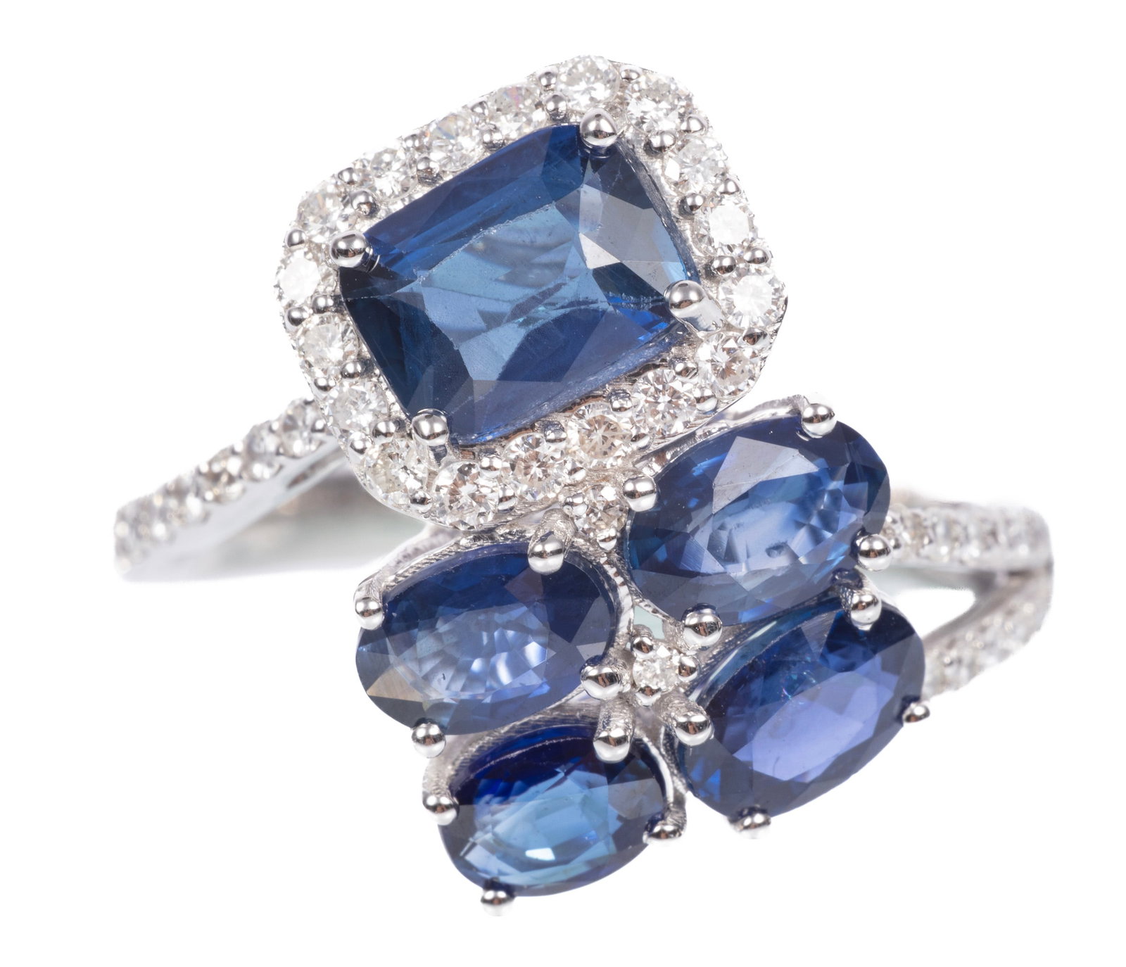 14 kt. White Gold and Sapphire Ring: 14 kt. White Gold and Sapphire Ring mounted with 3.35 cts. of blue sapphires; and 0.35 ct. of round brilliant cut diamonds; size 6.75; IAS report. Please Note: Payment for all jewelry and all couture 
