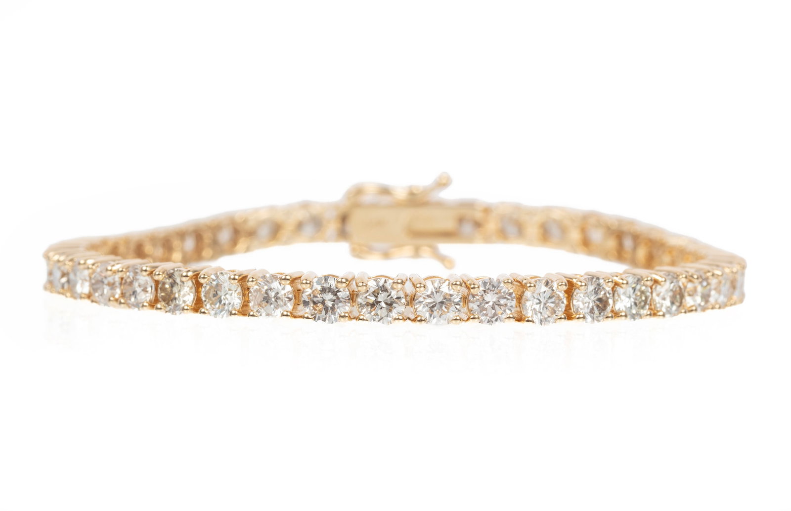 14 kt. Yellow Gold and Diamond Tennis Bracelet: 14 kt. Yellow Gold and Diamond Tennis Bracelet mounted with 42 round brilliant cut diamonds, total wt. approx. 12.00 cts., G-H color, SI1 to SI2 clarity; l. 7 in.; GGA report. Please Note: Payment for