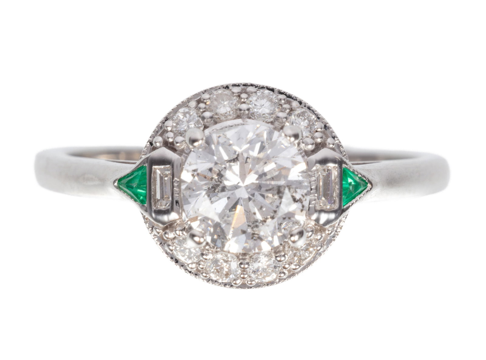 18 kt. White Gold, Diamond and Emerald Ring: 18 kt. White Gold, Diamond and Emerald Ring center round diamond, wt. approx. 1.01 cts.; accented by 2 trianon cut emeralds and a diamond bezel; size 7; 2.24 dwts. Please Note: Payment for all jewelry