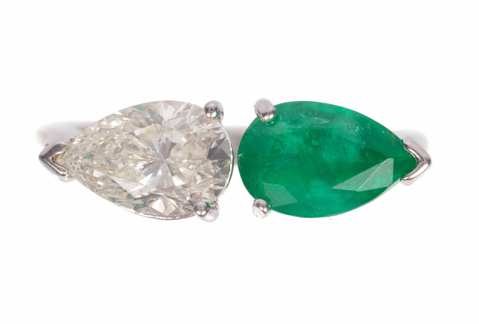 14 kt. and 18 kt. White Gold, Emerald and Diamond Toi et Moi Ring: 14 kt. and 18 kt. White Gold, Emerald and Diamond Toi et Moi Ring mounted with one pear shape diamond, wt. approx. 1.36 cts.; and one pear shape emerald, wt. approx. 1.62 cts.; 2.65 dwts.; size 7.25; 