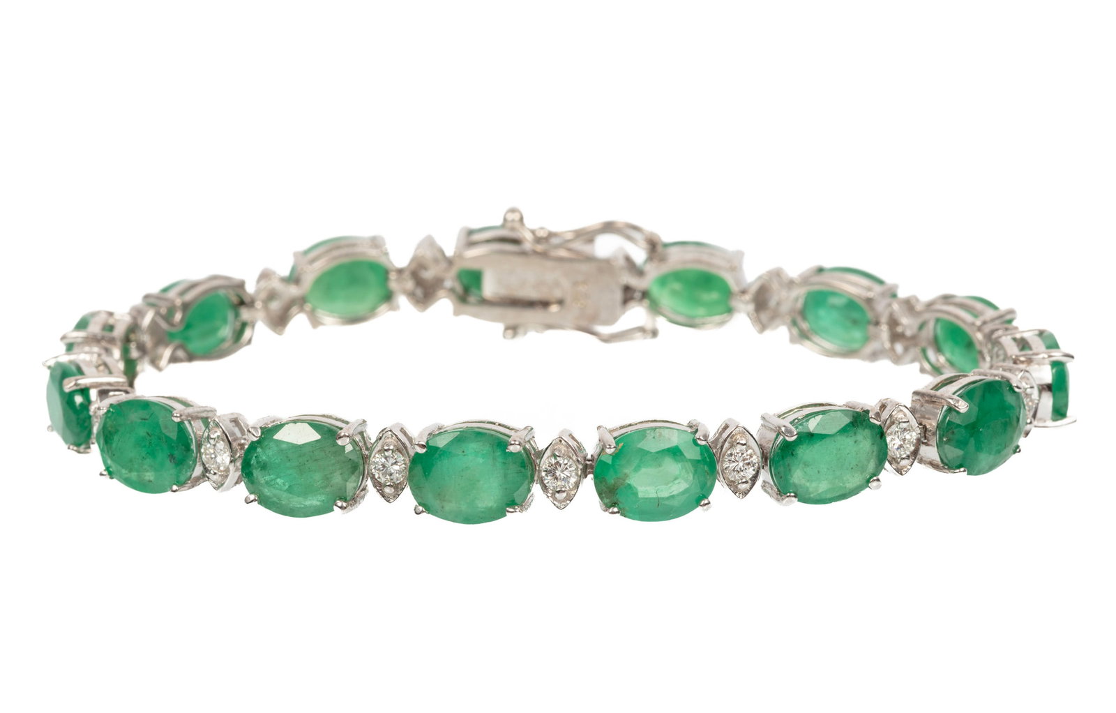 14 kt. White Gold, Emerald and Diamond Bracelet: 14 kt. White Gold, Emerald and Diamond Bracelet mounted with 15 oval cut emeralds, wt. approx. 24.08 cts.; and 0.94 ct. of round diamonds; l. 7 1/2 in. 12.56 dwts.; GIA report. Please Note: Payment fo