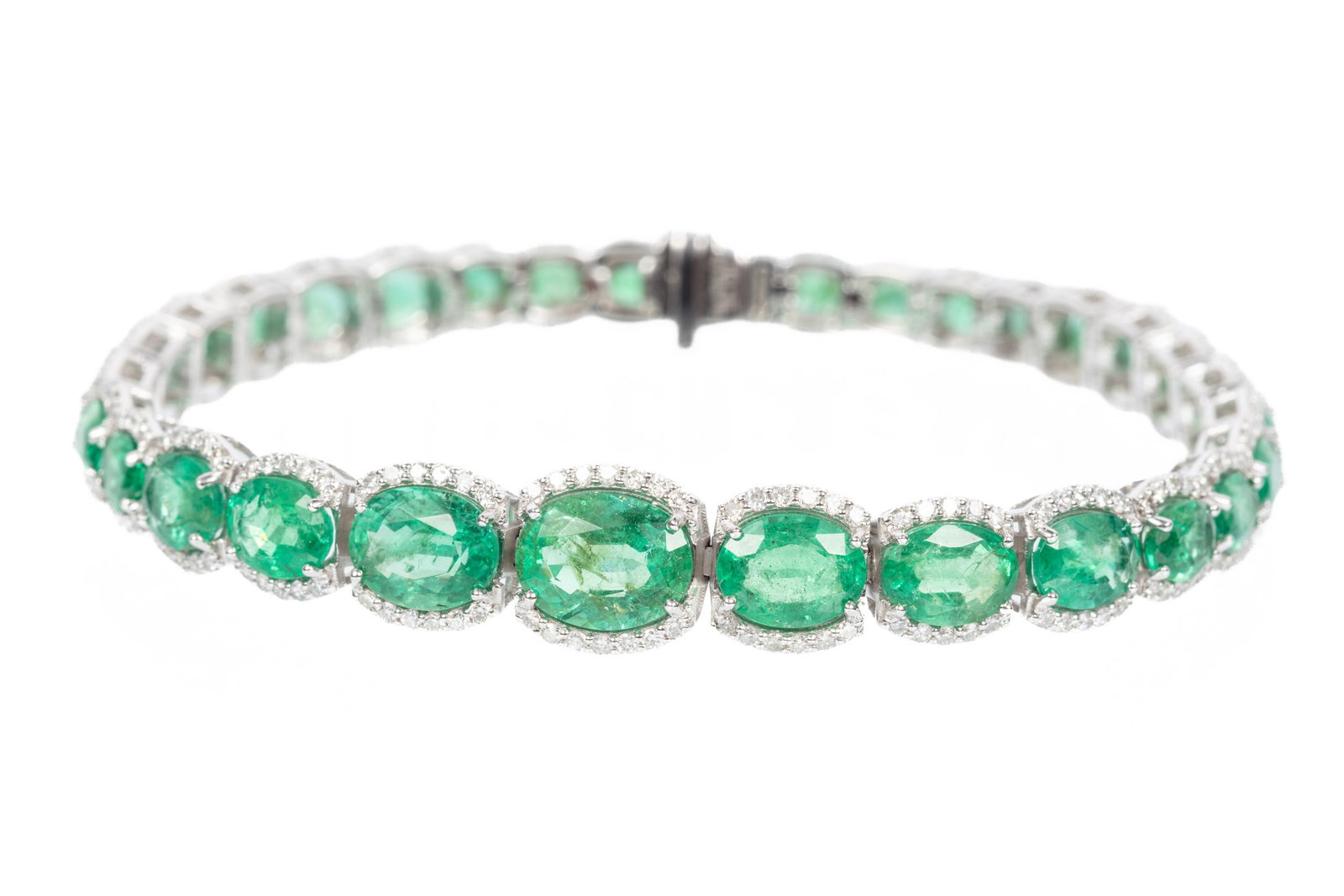 Platinum, Emerald and Diamond Bracelet: Platinum, Emerald and Diamond Bracelet mounted with 31 oval mixed cut emeralds, total wt. approx. 14.08 cts.; and 270 round brilliant cut diamonds, total wt. approx. 1.91 cts., F-G color, VS1-SI2 clar