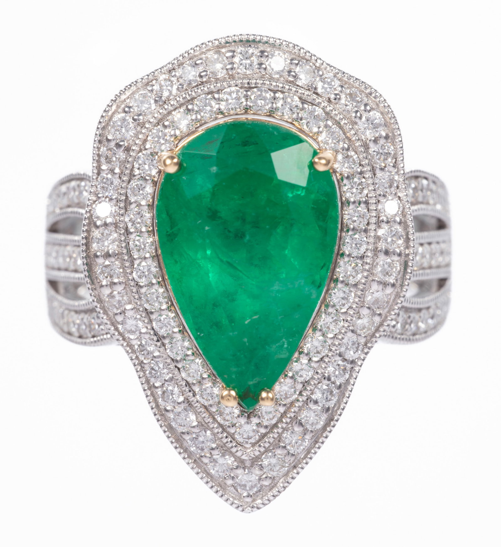 Platinum, 18 kt. Yellow Gold, Emerald and Diamond Ring: Platinum, 18 kt. Yellow Gold, Emerald and Diamond Ring center pear mixed cut emerald, wt. approx. 4.41 cts.; double bezel and shoulders with 0.96 ct. of round brilliant cut diamonds; size 7; GGA and G