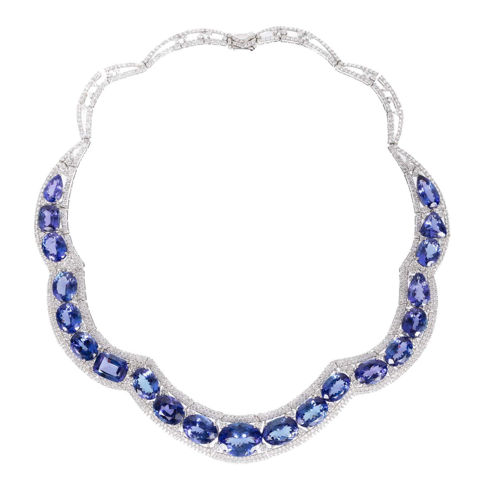 14 kt. White Gold, Tanzanite and Diamond Bib Necklace: 14 kt. White Gold, Tanzanite and Diamond Bib Necklace mounted with 21 oval, pear, triangular and rectangular cushion mixed cut tanzanite, total wt. approx. 121.44 cts.; and 917 round brilliant cut dia