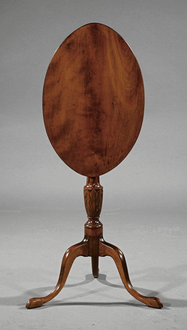 American Chippendale Carved Birch Candlestand: An American Chippendale Carved Birch Candlestand, late 18th c., Salem, Massachusetts, elliptical top, fluted and acanthus carved vasiform stem, snake feet, height 28 in., width 21 1/2 in., depth 14 1/