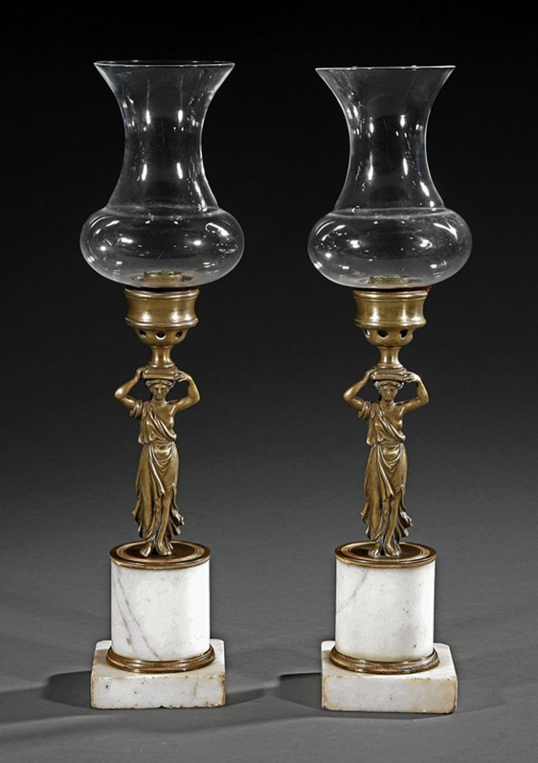 Regency Gilt Bronze, Marble Figural Candlesticks: A Rare Pair of Regency Gilt Bronze and Marble Figural Candlesticks, early 19th c., each standard molded as a Classical female figure, columnar pedestal, plinth base, glass storm shades, overall height