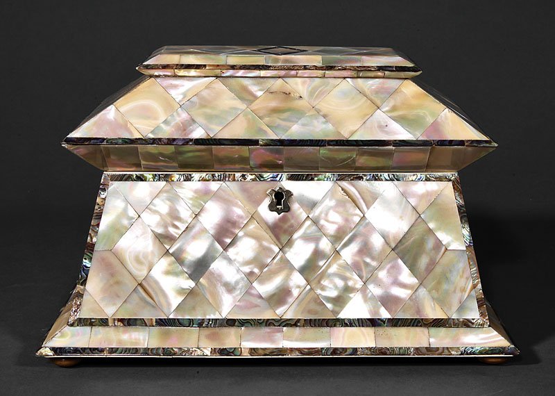 Mother-of-Pearl and Haliotis Banded Tea Caddy: A Late Georgian Mother-of-Pearl and Haliotis Banded Sarcophagus Form Tea Caddy, 19th c., silvered shield-shape escutcheon, suppressed ball feet, interior also with haliotis banding, two lidded compart
