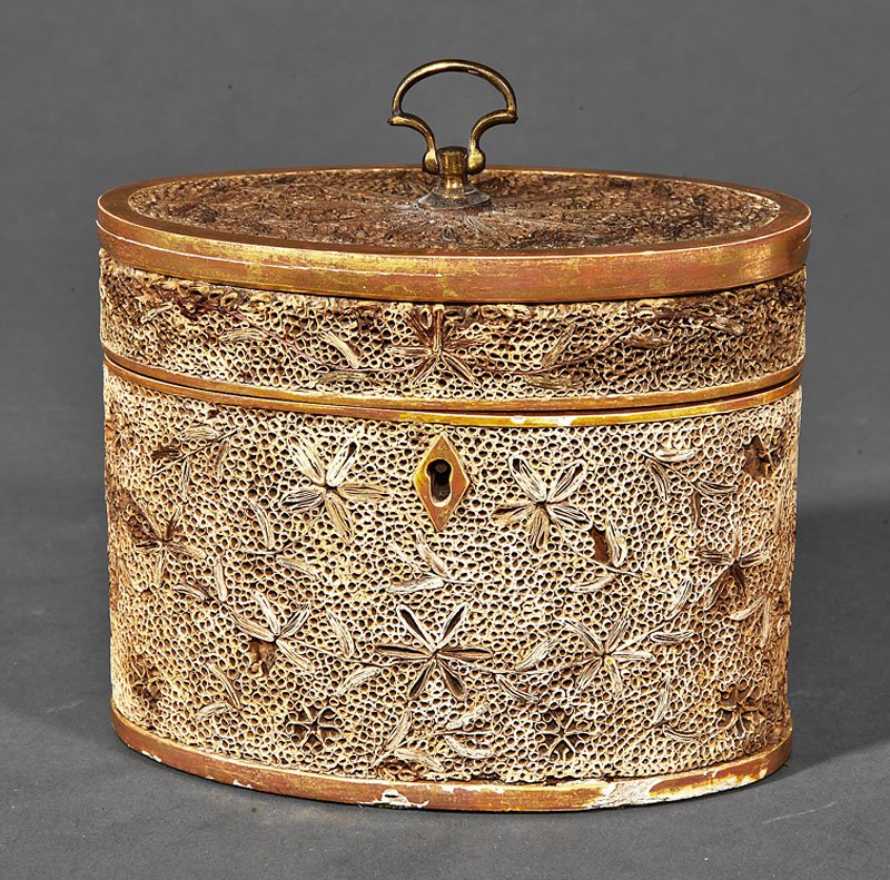 George III Quillwork and Giltwood Oval Tea Cadddy: A George III Quillwork and Giltwood Oval Tea Caddy, c. 1790, with brass loop handle, lozenge escutcheon, retains interior quillwork lid, some small losses, height 5 3/4 in., width 5 5/8 in., depth 3 1