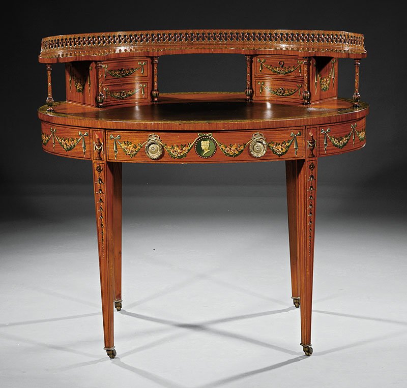 Paint-Decorated Satinwood Carlton House Desk: A Fine Edwardian Adam-Style Paint-Decorated Satinwood Carlton House Desk, late 19th/early 20th c., demilune galleried superstructure with drawers and tapered colonettes, oval top with inset tooled lea