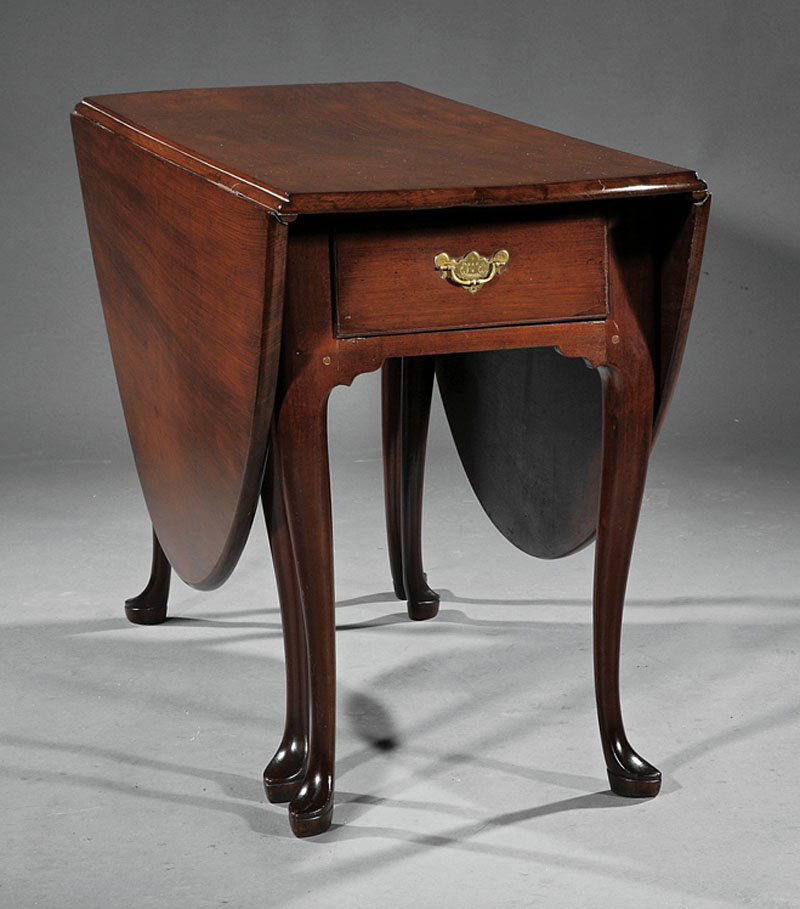 ueen Anne Carved Mahogany Dining Table: A Fine Queen Anne Carved Mahogany Dining Table, mid-18th c., New York, oval drop leaf top, frieze fitted with a drawer at each end, cabriole legs, slipper feet, poplar and oak secondary woods, height