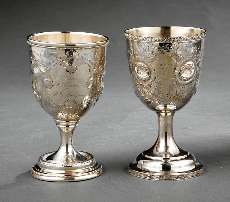 Two American Coin Silver Presentation Goblets: Two Good American Coin Silver Repousse Presentation Goblets, mid-19th c., unmarked; one having a bell-shaped bowl with guilloche rim, floral decor, tapering stem with Greek Key footrim, retains traces