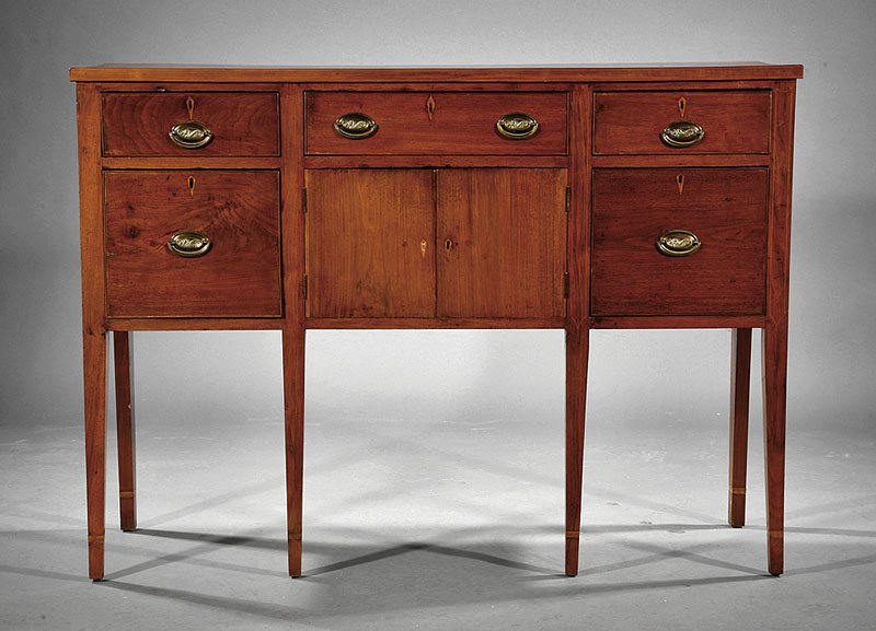 Federal Carved and Inlaid Walnut Sideboard: An American Federal Carved and Inlaid Walnut Sideboard, early 19th c., Southern, probably Virginia, rectangular top, three frieze drawers, over doors flanked by deep drawers square tapered cuffed legs