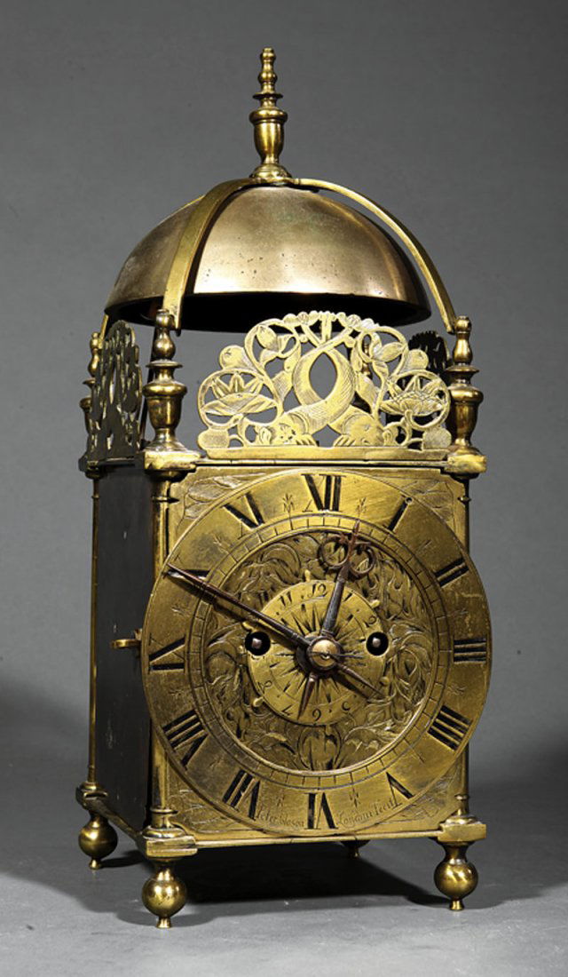 English Second Period Lantern Clock, Peter Closon: An English Second Period Lantern Clock, c. 1650, marked "Peter Closon, Londini Fecit", strapped striking bell, over finials and dolphin frets, dial plate with foliate engraving, the alarm disk with fl