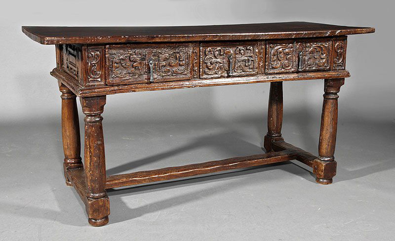 Spanish Baroque Carved Walnut Refectory Table: An Antique Spanish Baroque Carved Walnut Refectory Table, probably 17th c., plank top, three frieze drawers, paneled sides, turned and blocked legs, stretchers, disc feet, height 30 1/2 in., length 60
