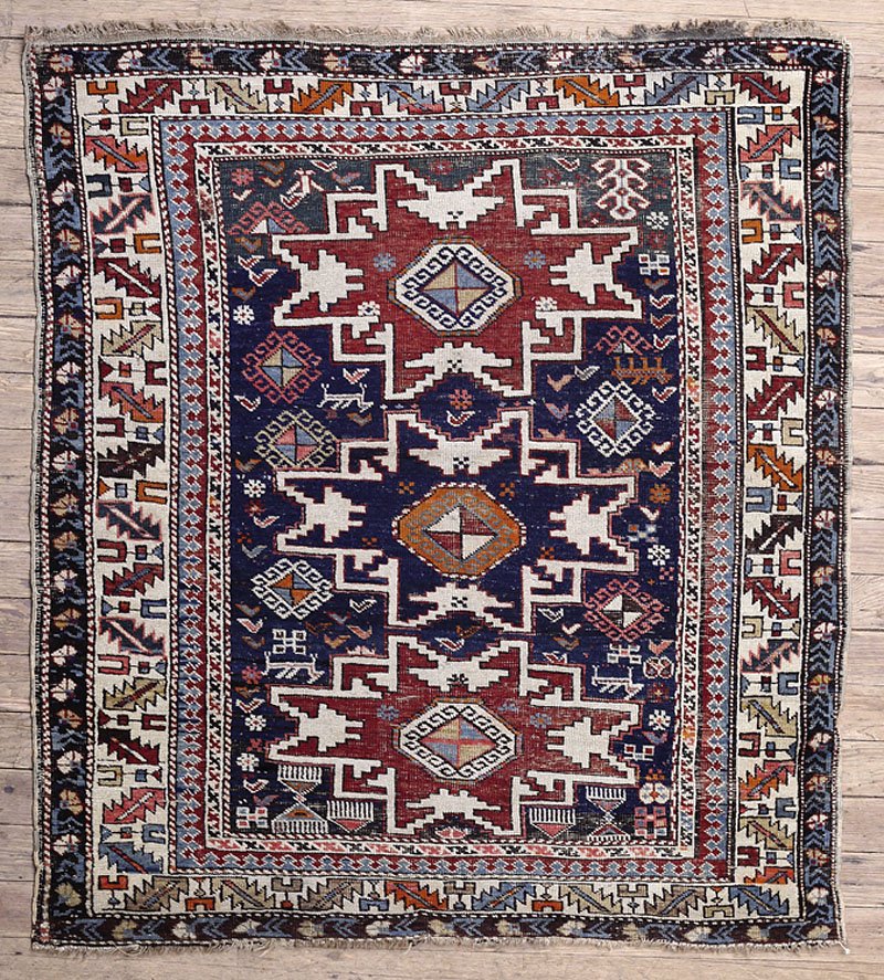 Shirvan Caucasian Carpet: A Shirvan Caucasian Carpet, red and blue ground, 3 ft. 6 in. x 4 ft. 5 in. Provenance: Acquired from C.J. Larson, 1986.