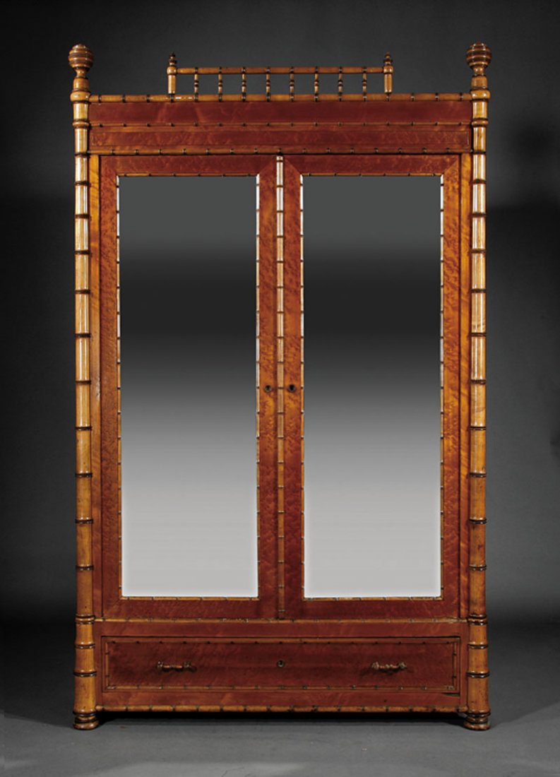 An American Aesthetic Maple Faux Bamboo Armoire: An American Aesthetic Maple Faux Bamboo Armoire, c. 1880, New York, cornice with spindled crest flanked by beehive ball finials, paneled frieze over mirrored doors, divided interior, long drawer below