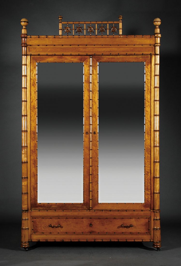 An American Aesthetic Maple Faux Bamboo Armoire: An American Aesthetic Maple Faux Bamboo Armoire, c. 1880, New York, cornice with reticulated crest flanked by ball finials, paneled frieze over mirrored doors, divided interior, long drawer below, tur