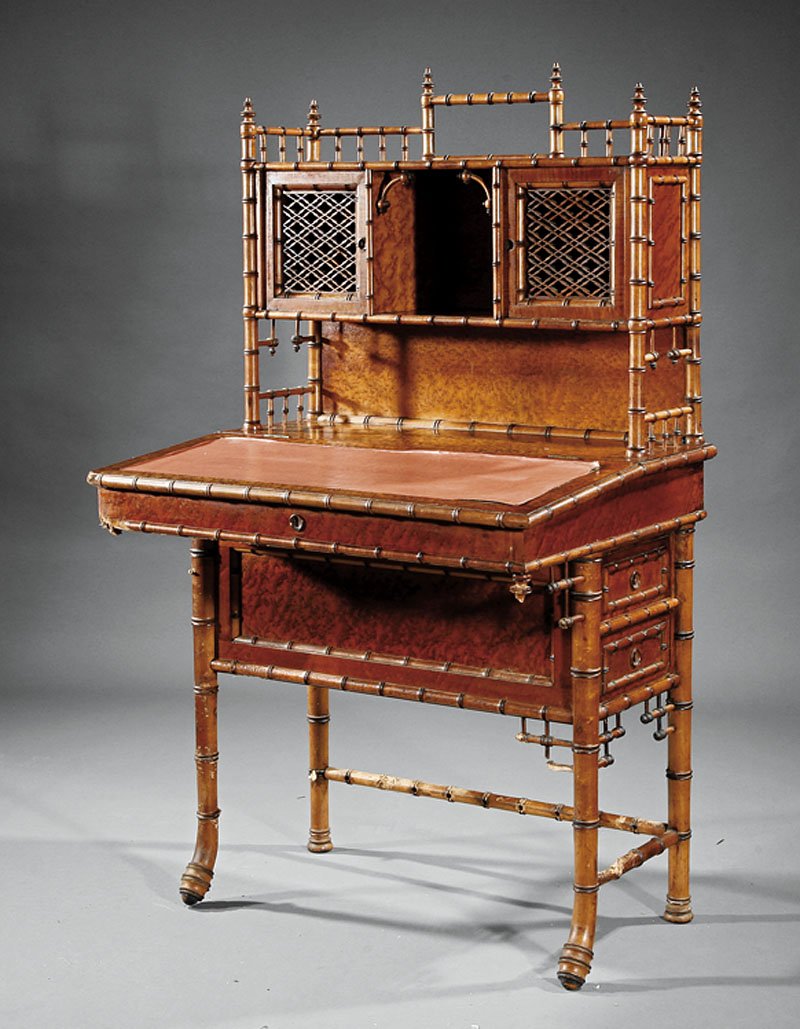An American Aesthetic Writing Desk: An American Aesthetic Birdseye Maple and Maple Faux Bamboo Writing Desk, c. 1880, New York, superstructure with spindled gallery, central compartment flanked by carved latticework doors, desk with hin
