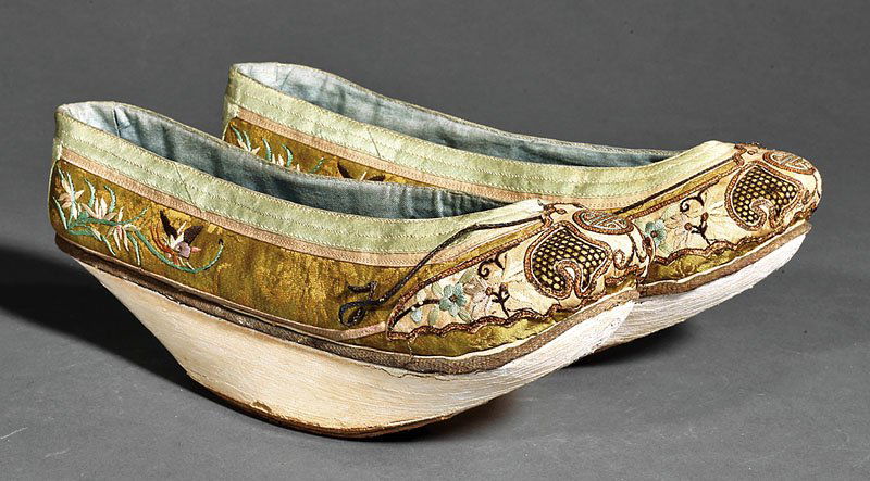 A Pair of Chinese Manchu Lady's Shoes: A Pair of Chinese Manchu Lady's Shoes, late 19th/early 20th c., each with embroidered brocade tops above painted wood pedestal soles, height 3 1/2 in., length 9 1/2 in