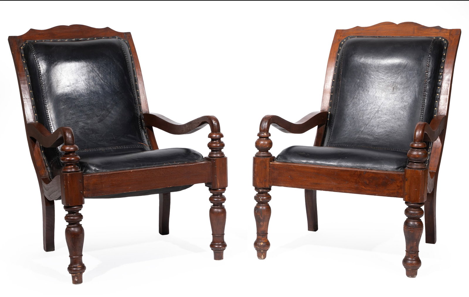 Pair of British Colonial-Style Carved Hardwood Campeche Chairs: Pair of British Colonial-Style Carved Hardwood Campeche Chairs early 20th c., nailhead leather upholstery, shaped crest rail, scrolled back, conforming arms, turned legs