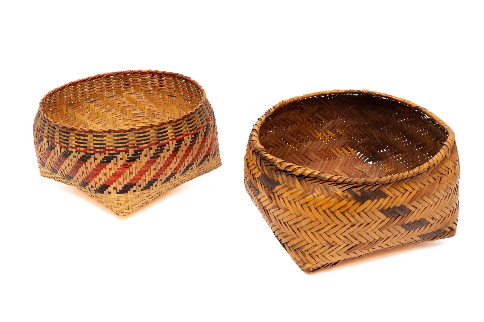 Two Indigenous Bowl Baskets: Two Indigenous Bowl Baskets smaller Chitimacha woven by Darden Family, larger is Choctaw; natural, red, and black river cane. taller h. 6 in., w. 11 1/2 in., d. 11 in.; dimensions variable