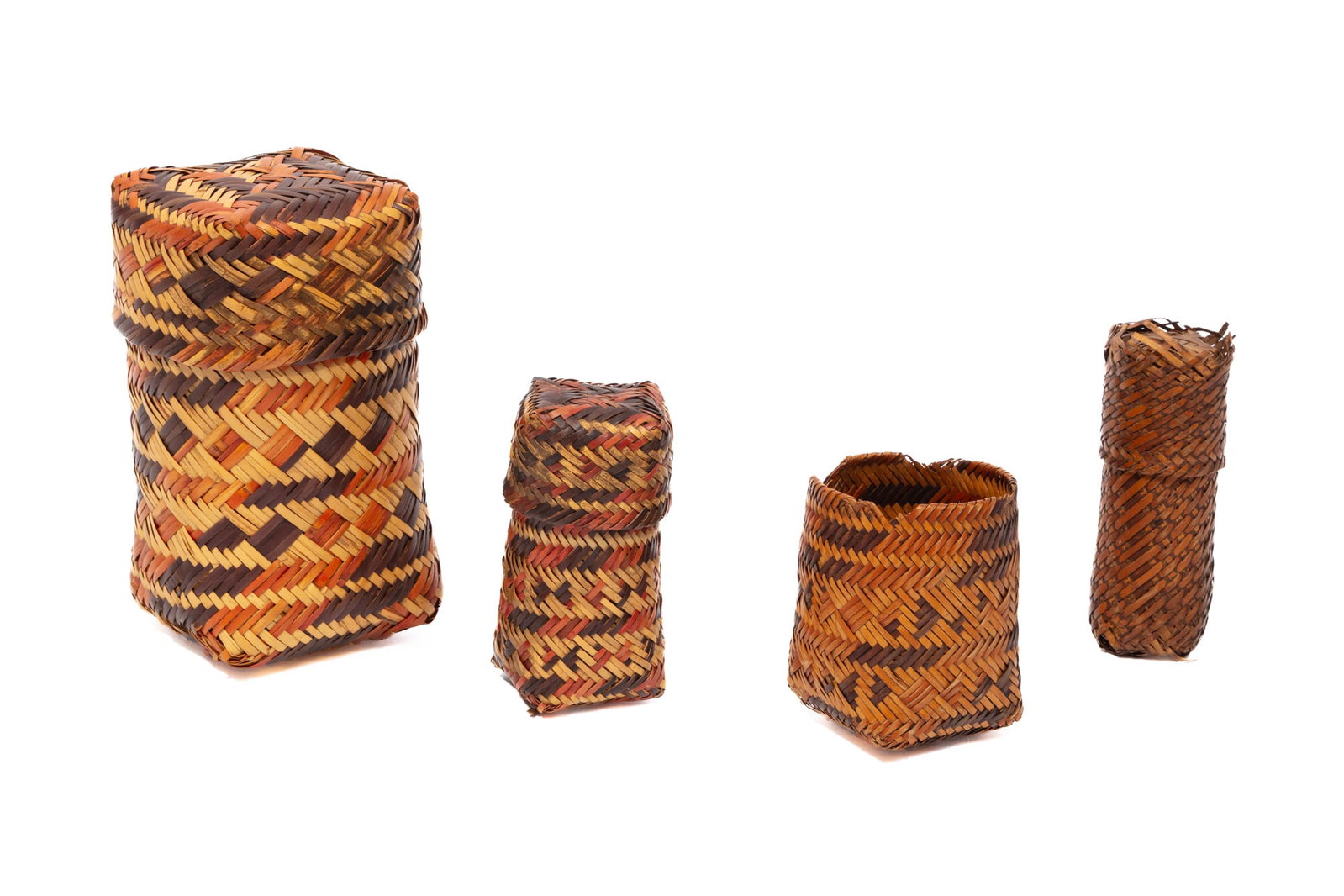 Four Chitimacha Double Weave Trinket Baskets: Four Chitimacha Double Weave Trinket Baskets natural, red, and black rivercane. tallest h. 6 1/4 in., w. 4 1/4 in., d. 4 in.; dimensions variable