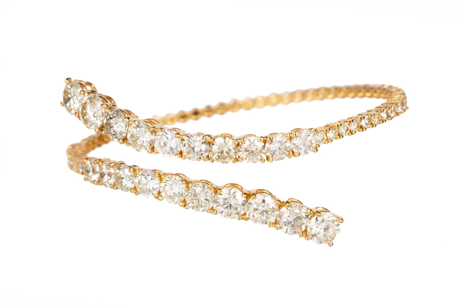 14 kt. Yellow Gold and Diamond Cuff Bracelet | 10.04 tcw: 14 kt. Yellow Gold and Diamond Cuff Bracelet flexible design mounted with 10.04 cts. of round briliant cut diamonds; inner circ. 6 1/4 in. Please Note: Payment for all jewelry and all couture items MU
