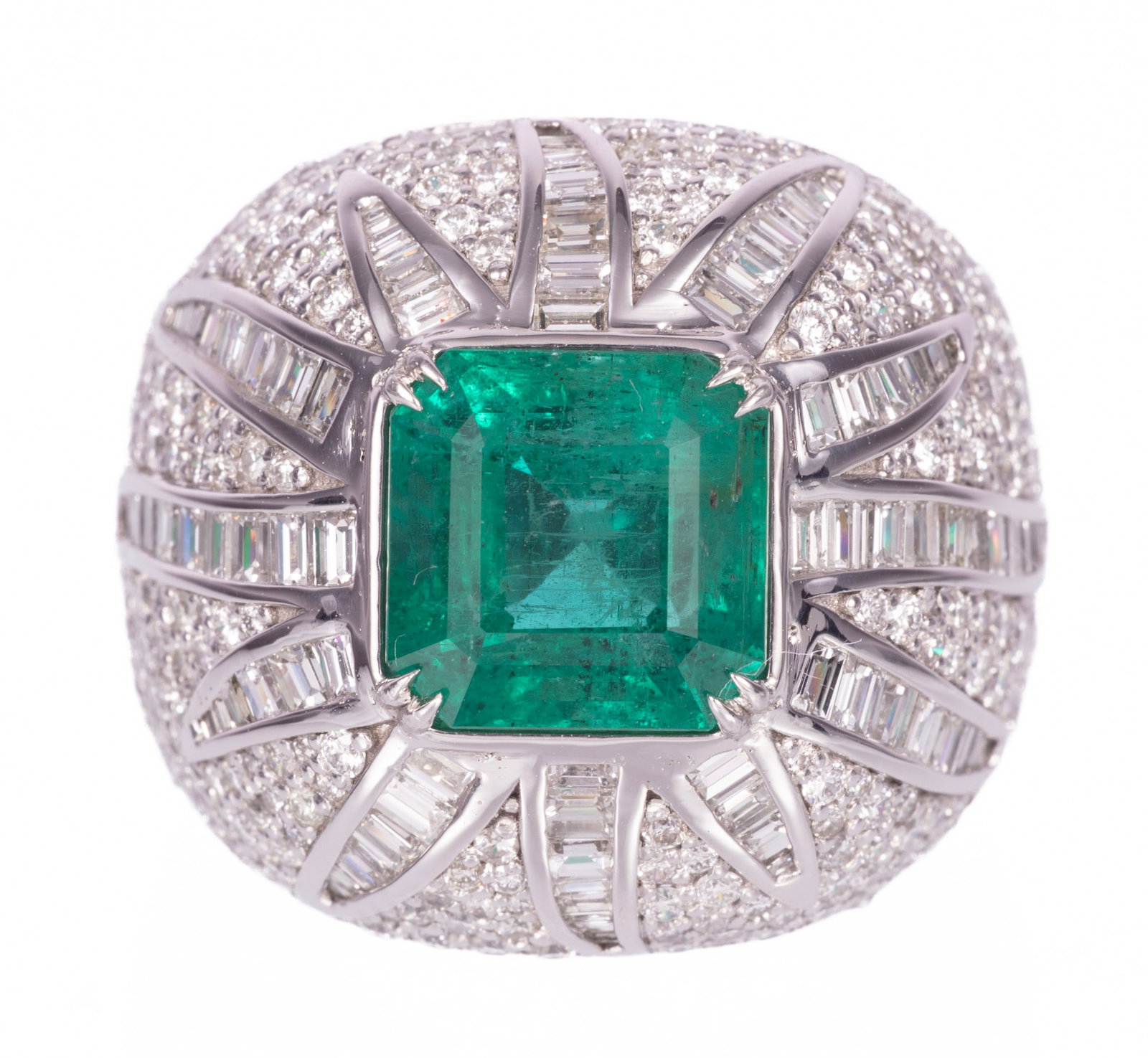 Platinum, 4.58 carat Emerald and Diamond Sunburst Dome Ring: Platinum, Emerald and Diamond Sunburst Dome Ring center no oil octagonal mixed cut emerald, wt. approx. 4.58 cts.; mounted with 3.58 cts. of baguette and round brilliant cut diamonds, F-G color, VS1-V