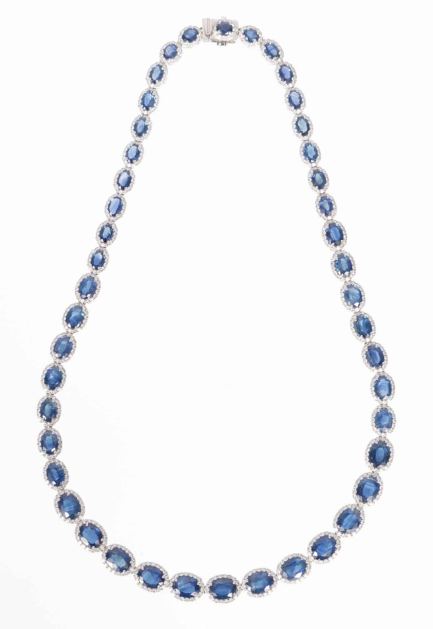 Platinum, Sapphire and Diamond Necklace | 41.19 sapphire tcw: Platinum, Sapphire and Diamond Necklace mounted with 45 oval brilliant cut sapphires, total wt. approx. 41.19 cts.; and 6.96 cts. of round brilliant cut diamonds; l. 17 in.; GGA report. Please Note: