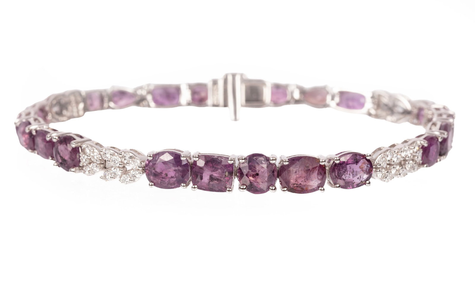 Platinum, Kashmir Sapphire and Diamond Line Bracelet | 18.81 tcw: Platinum, Kashmir Sapphire and Diamond Line Bracelet mounted with 23 mixed cut sapphires, total wt. approx. 18.81 cts.; and 1.01 cts. of round brilliant cut diamonds; l. 7 in.; GGA and GIA reports.