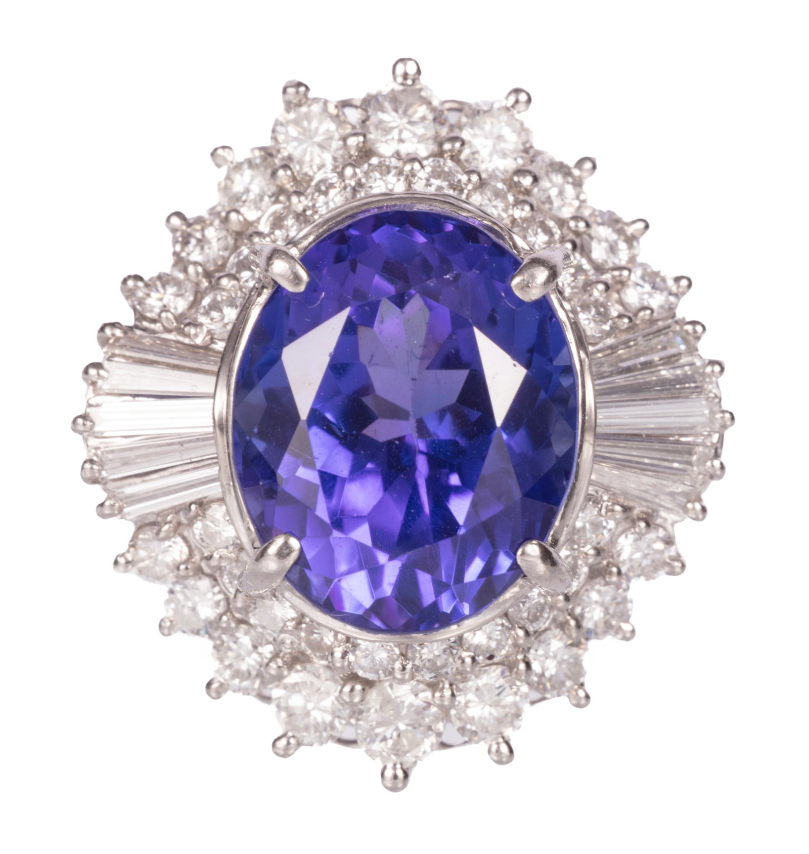 Platinum, 6.85 carat Tanzanite and Diamond Ring: Platinum, Tanzanite and Diamond Ring center oval mixed cut tanzanite, wt. approx. 6.85 cts.; and 1.33 cts. of baguette and round brilliant cut diamonds; size 4.75; GGA report. Please Note: Payment for