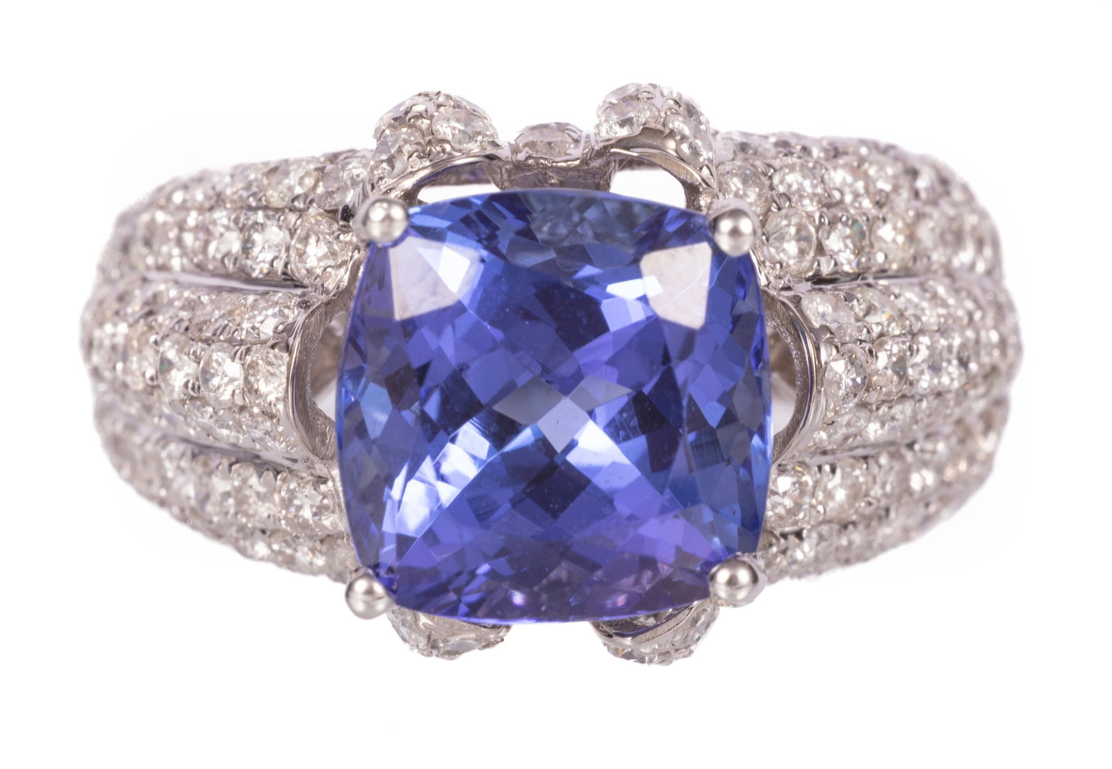 14 kt. White Gold, 5.11 carat Tanzanite and Diamond Ring: 14 kt. White Gold, Tanzanite and Diamond Ring center cushion brilliant faceted cut tanzanite, wt. approx. 5.11 cts.; mounted with 1.91 cts. of round brilliant cut diamonds; size 7; GGA report. Please 