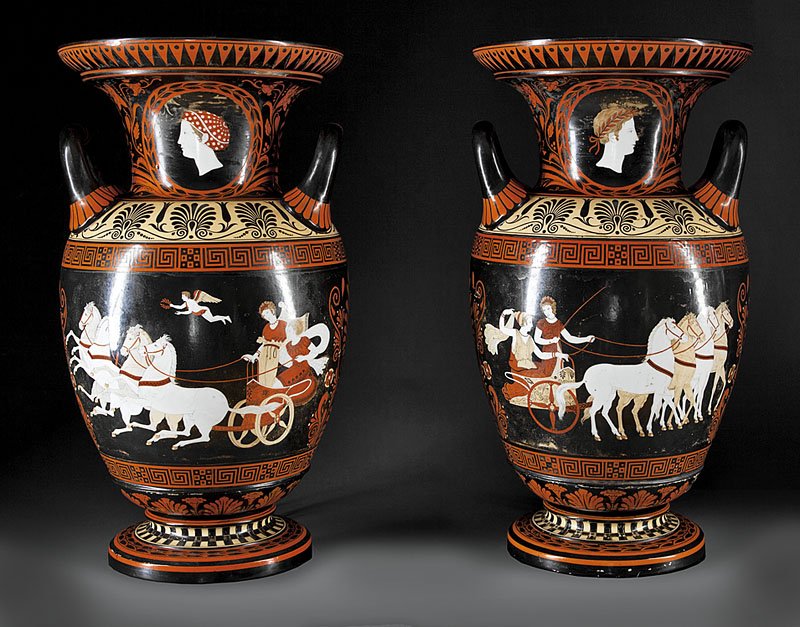 A Pair of English "Etruscan" Urns: A Monumental Pair of English Polychrome Porcelain "Etruscan" Urns, mid-19th c., each of amphora form, neck with portrait medallion, paint decorated with Greek motifs, frieze depicting warrior youth an
