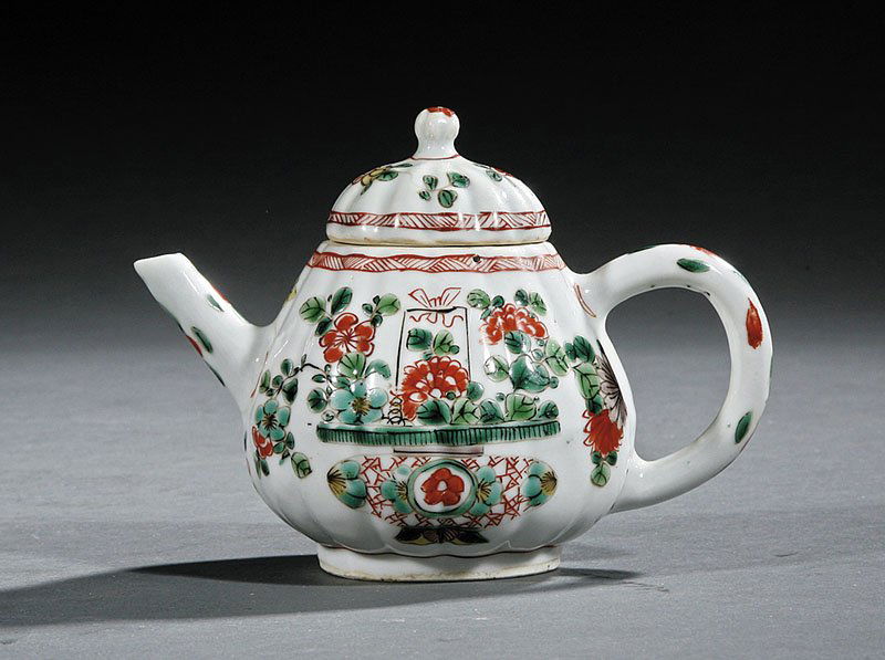 Covered Teapot, Kangxi Period (1662-1722): A Chinese Famille Verte Export Porcelain Covered Teapot, Kangxi Period (1662-1722), molded pear form body decorated with floral sprays, height 4 in., width 6 in. Provenance: Sotheby's, New York, Sale