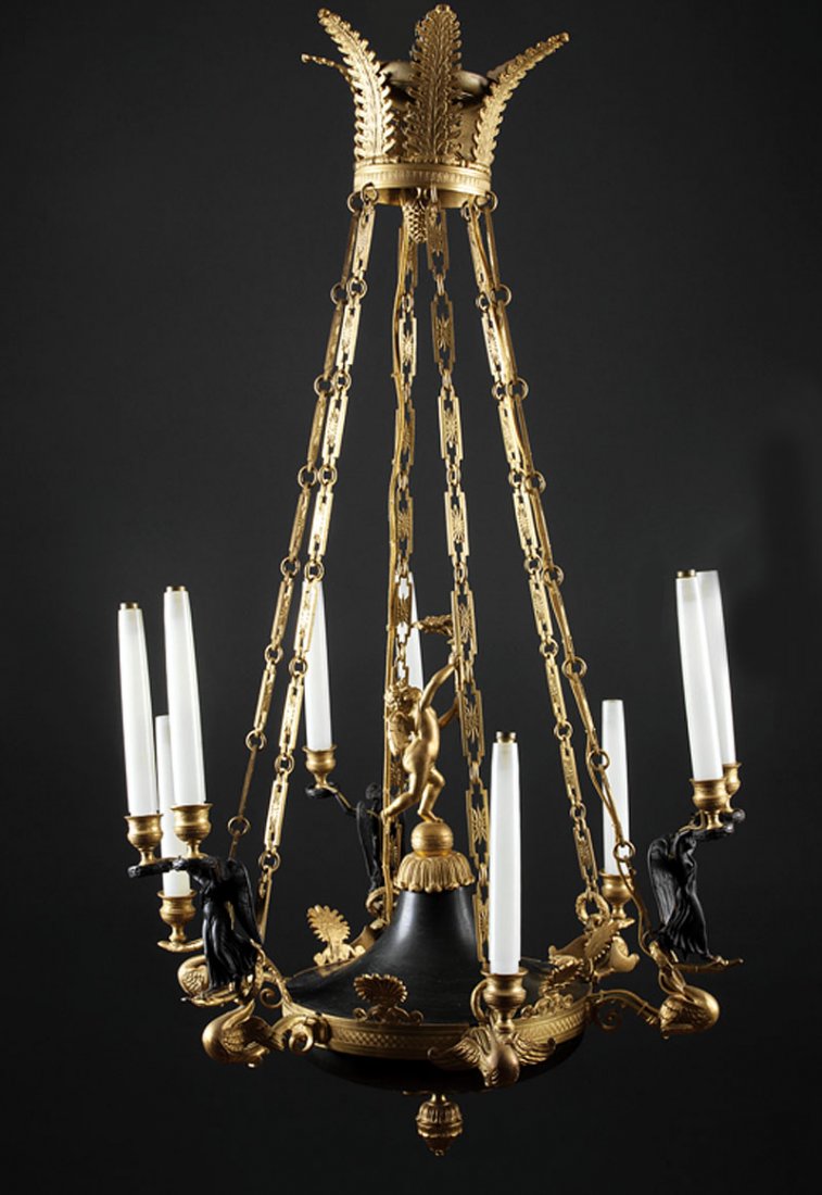 A Empire-Style Nine-Light Chandelier: A Fine Empire-Style Gilt Bronze and Tole Nine-Light Chandelier, 19th c., circular corona with acorn pendant, dome surmounted by Eros holding a torch, swan form branches with alternating winged Victori