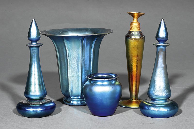 A Group of Steuben Blue Aurene Glass: A Group of Steuben Blue Aurene Glass, 20th c., including a ruffled flare vase, marked, height 5 1/4 in.; a pair of perfume bottles with stoppers, marked, height 6 1/2 in.; together with a small blue i